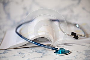 Stethoscope and book