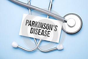 Stethoscope, paper with Parkinson's Disease text on the medical table