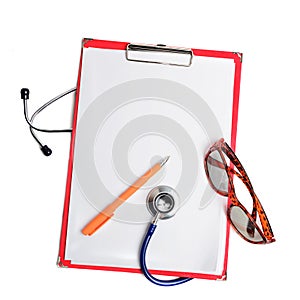 Stethoscope, pen and glasses on red clipboard cut out