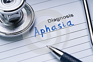 Stethoscope And Pen Over Form With Diagnosis Aphasia