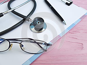 Stethoscope pen paper glasses