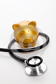 Stethoscope and Piggy Bank