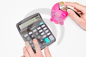Stethoscope and piggy bank for financial health check concept