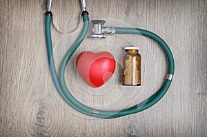 Stethoscope, pills and a heart