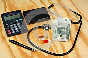 Stethoscope on polish money - medical concept