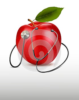 Stethoscope and red apple.