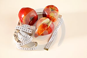 Stethoscope with red apples on a white background