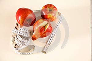 Stethoscope with red apples on a white background