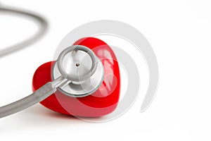 Stethoscope and red heart isolated on white background