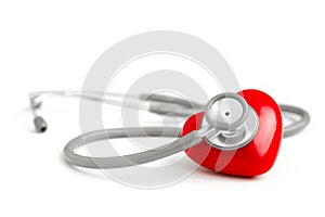 Stethoscope and red heart isolated on white background