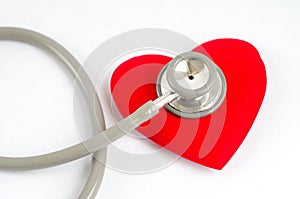 Stethoscope with red heart on white background - Health care con