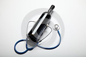 Stethoscope and red wine, doctor recommendations for drinking alcohol