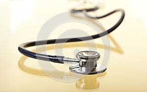 Stethoscope with Reflection on Gold