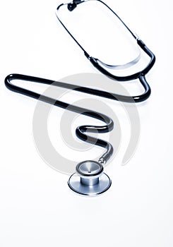 Stethoscope in the shape of heart beat isolated on white background.
