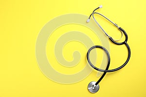 Stethoscope with space for text on color background. Medical tool