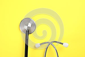 Stethoscope with space for text on color background. Medical tool