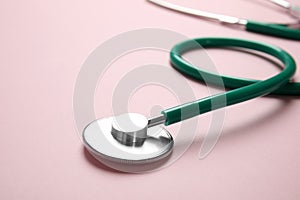 Stethoscope with space for text on color background. Medical tool