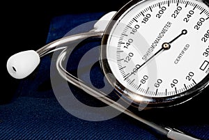 Stethoscope and sphygmomanometer on black background