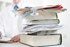 Stethoscope on a stack of medical books