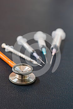 Stethoscope and syringe