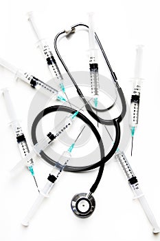 Stethoscope and syringes