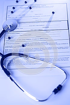 Stethoscope on the table and medical form of recipes
