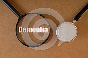 Stethoscope with text DEMENTIA. Dementia is a syndrome or group of symptoms that affect memory, thinking, behavior, and the