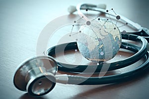 Stethoscope and texture globe with digital tablet