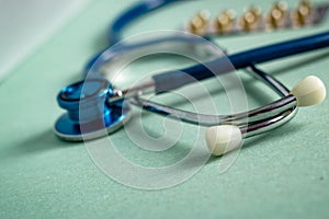 A stethoscope on a textured background, blur