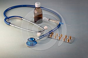 Stethoscope textured background, thermometer, syringe