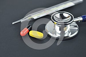 Stethoscope, Thermometer and Medications