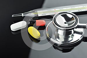 Stethoscope, Thermometer and Pills