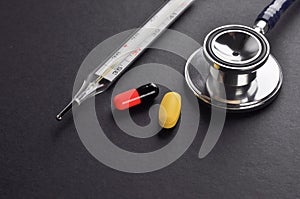 Stethoscope, Thermometer and Pills