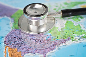 Stethoscope on USA America world globe map background