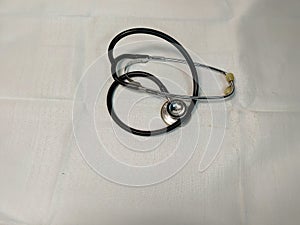 a Stethoscope on a white background,,A stethoscope is an examination tool commonly used by doctors. This tool functions