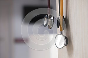 Stethoscope on wood wall in hospital ward