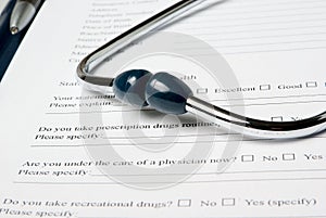 Stetjhoscope on medical questionnaire