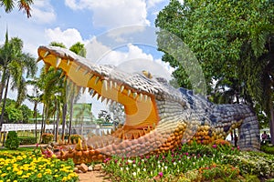 stetue of a large crocodile statue in the middle of Fa Park, Crocodile Museum at Bueng Si Fai, Phichit Province, .Another