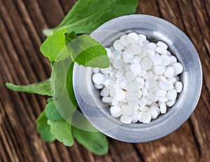 Stevia sweetener on wooden background