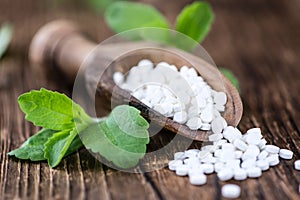 Stevia sweetener on wooden background