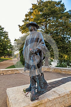 Stevie Ray Vaughan statue in front of downtown Austin and the Co