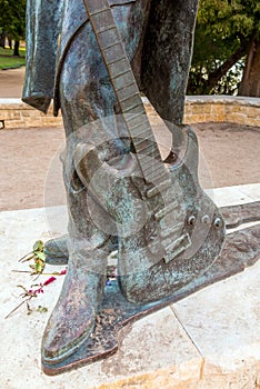 Stevie Ray Vaughan statue in front of downtown Austin and the Co