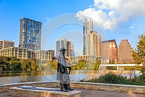 Stevie Ray Vaughan statue in front of downtown Austin and the Co photo