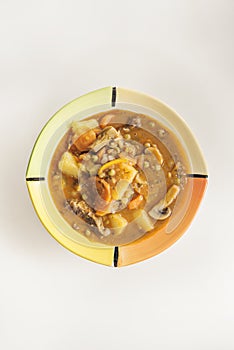 A stew is the cooking of a food in a closed container that prevent