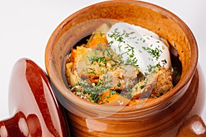 Stew with potatoes in a clay pot