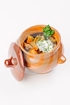 Stew with potatoes in a clay pot