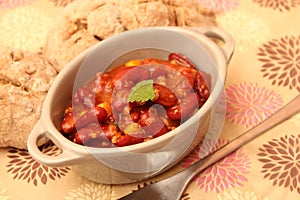 A stew of red beans, meat and corn