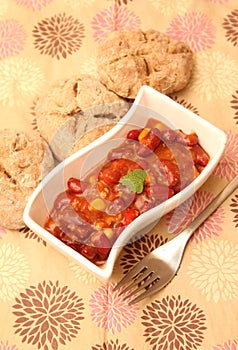 A stew of red beans, meat and corn