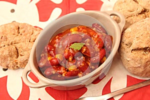 A stew of red beans, meat and corn