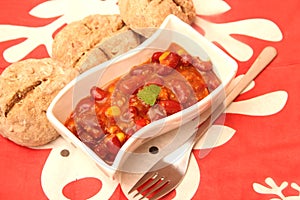 A stew of red beans, meat and corn